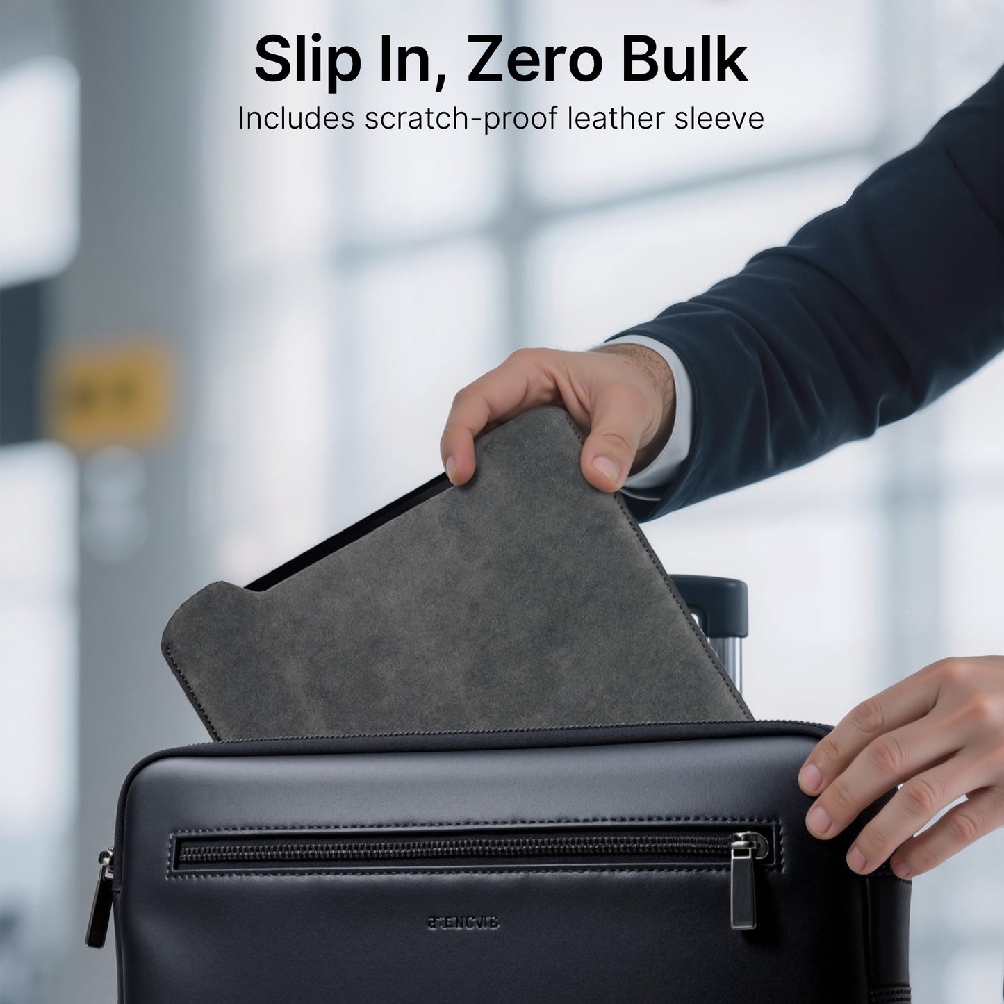 Person placing a gray scratch-proof leather sleeve into a black suitcase with a blurred background.