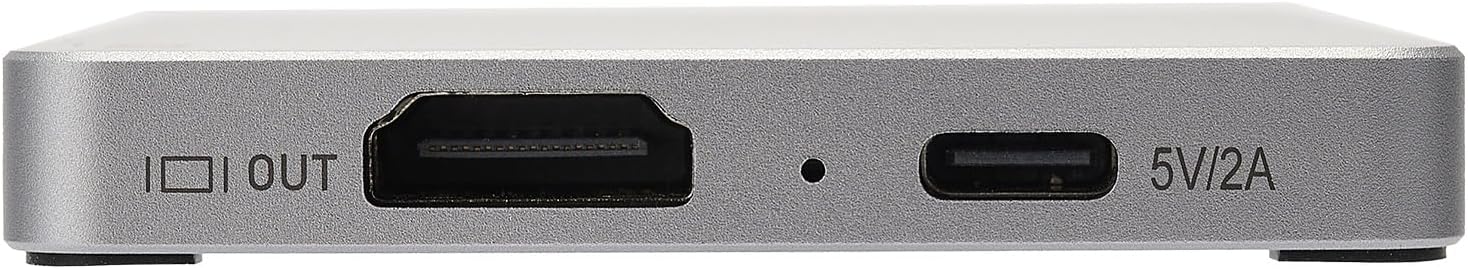 Close-up of a metallic device with ports and labels.