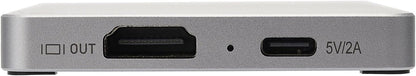 Close-up of a metallic device with ports and labels.