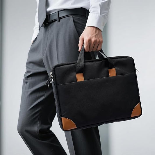 Person holding a black briefcase with brown accents against a light gray background